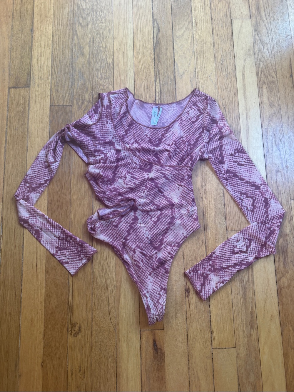 Out from under red snake print mesh body suit